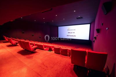 Miniature Location salle Caen (Calvados) - Pathé Les Rives de l'Orne #4 Intérieur d'un bâtiment moderne avec escalier, rambardes en métal, murs colorés et grandes baies vitrées.