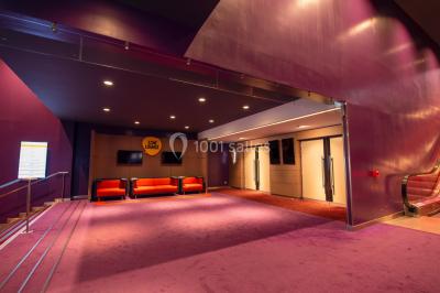 Miniature Location salle Caen (Calvados) - Pathé Les Rives de l'Orne #11 Intérieur d'un bâtiment moderne avec escalier, rambardes en métal, murs colorés et grandes baies vitrées.