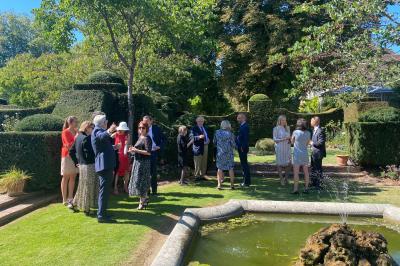 Miniature Location salle Triguères (Loiret) - Manoir du Grand Courtoiseau et ses Jardins Remarquables #21 Vaisselier rouge avec portes vitrées, contenant des verres, plats, bols et assiettes en céramique et en métal.