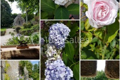 Salle de réception décorée avec des guirlandes lumineuses, remplie d'invités assis à des tables lors d'un événement.