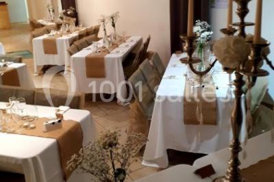 Miniature Location salle Rognes (Bouches-du-Rhône) - Domaine Naïs #2 Terrasse en pierre avec des tonneaux en bois, vue sur un paysage verdoyant et une clôture en fer forgé.