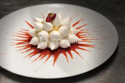 Miniature Location salle Divonne-les-Bains (Ain) - Domaine de Divonne #19 Salle de restaurant élégante avec tables dressées, chaises en bois sculpté et décor floral sur les murs et le sol.