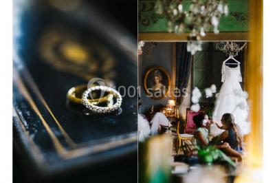 Salle en pierre avec arches, tables décorées et stands alignés, éclairage chaleureux créant une ambiance conviviale.