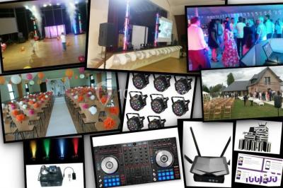 Groupe de personnes dansant sous des lumières colorées dans une salle avec un plafond industriel.