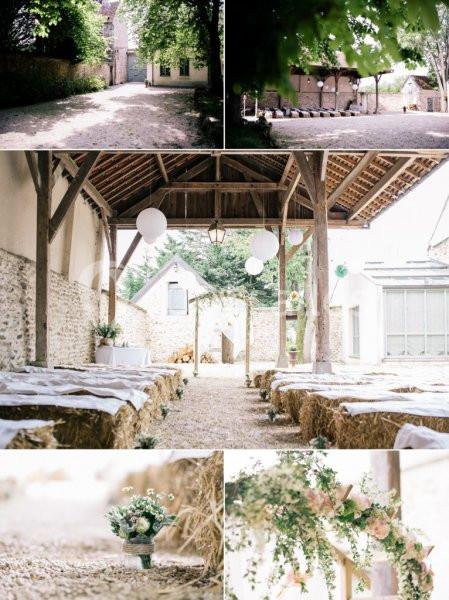 Espace extérieur décoré pour un mariage, avec bottes de paille, lanternes suspendues et fleurs.