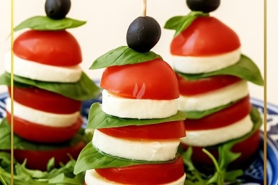 Assiette gastronomique avec tranches de poisson, agrumes, radis, croustillant décoratif et points de sauce balsamique.