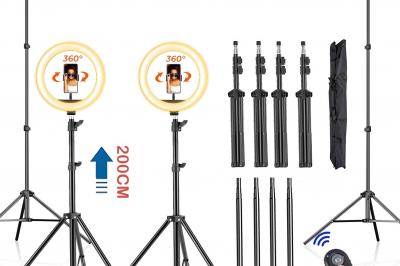 Kit de studio photo avec trépieds réglables, anneaux lumineux, télécommande et accessoires de montage.