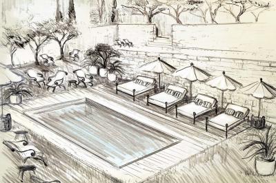 Olivier devant le toit de l'ancien pigeonnier 