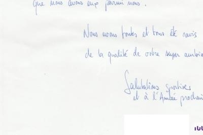 Texte manuscrit bleu sur fond blanc exprimant des remerciements et des salutations pour une prochaine rencontre.