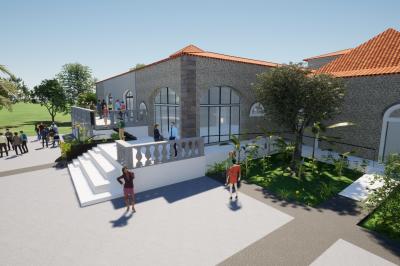 Vue d'un bassin avec toboggans aquatiques, entouré de végétation, de rochers et de jarres décoratives.