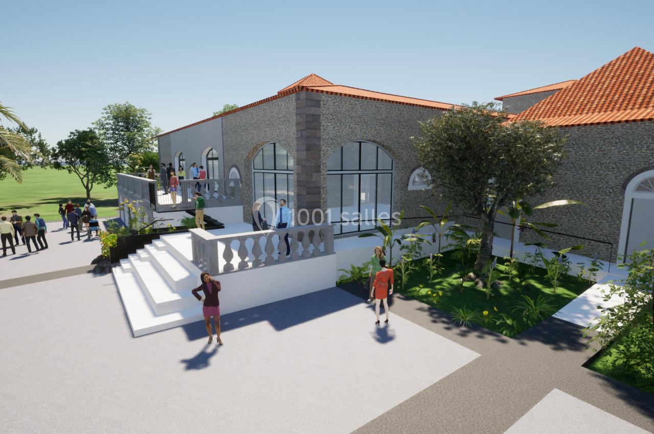 Vue extérieure d'un bâtiment en pierre avec toit en tuiles rouges, entouré de végétation et de personnes.