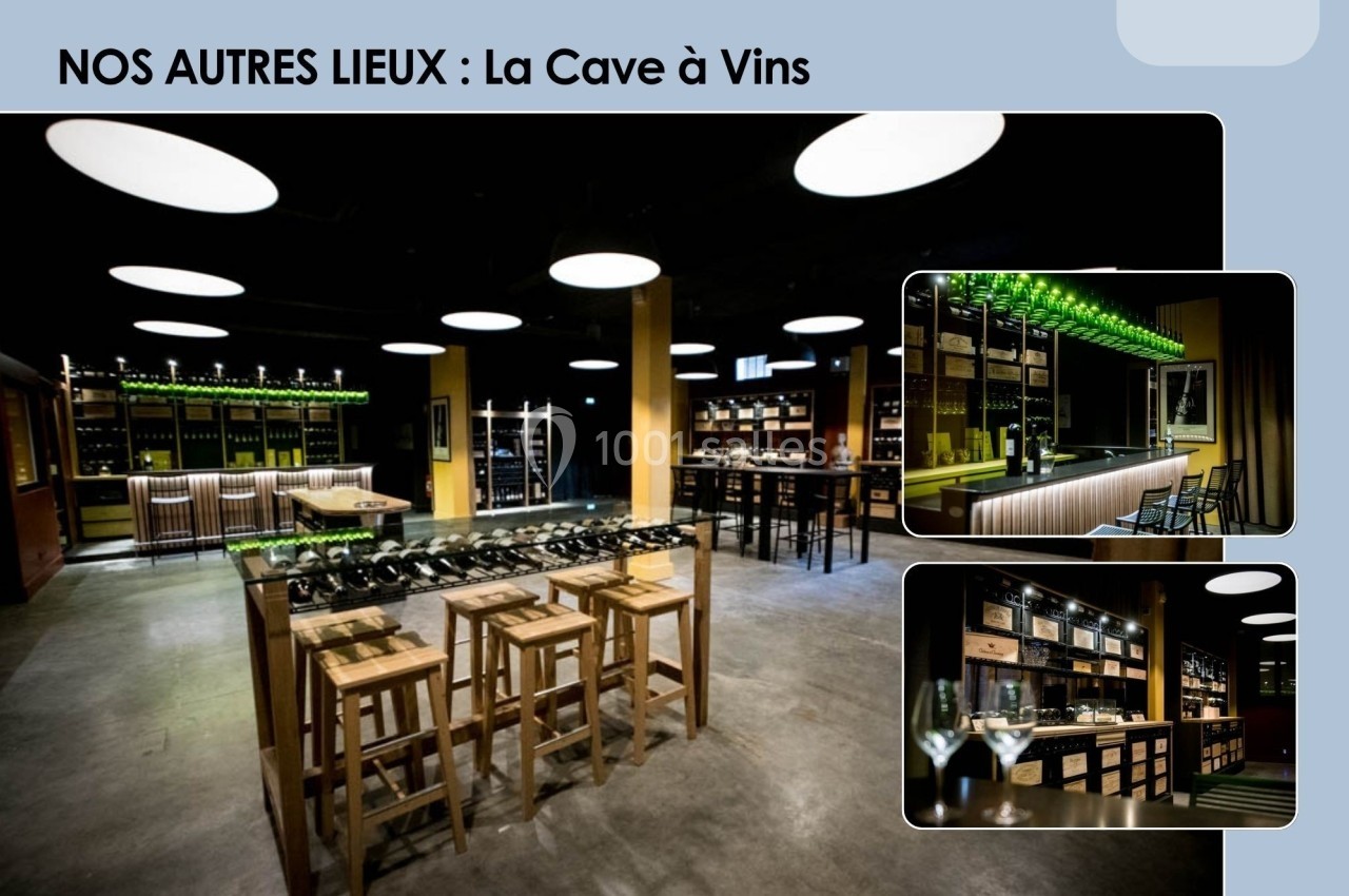 Salle moderne de dégustation de vins avec tables hautes, étagères remplies de bouteilles et éclairage chaleureux.