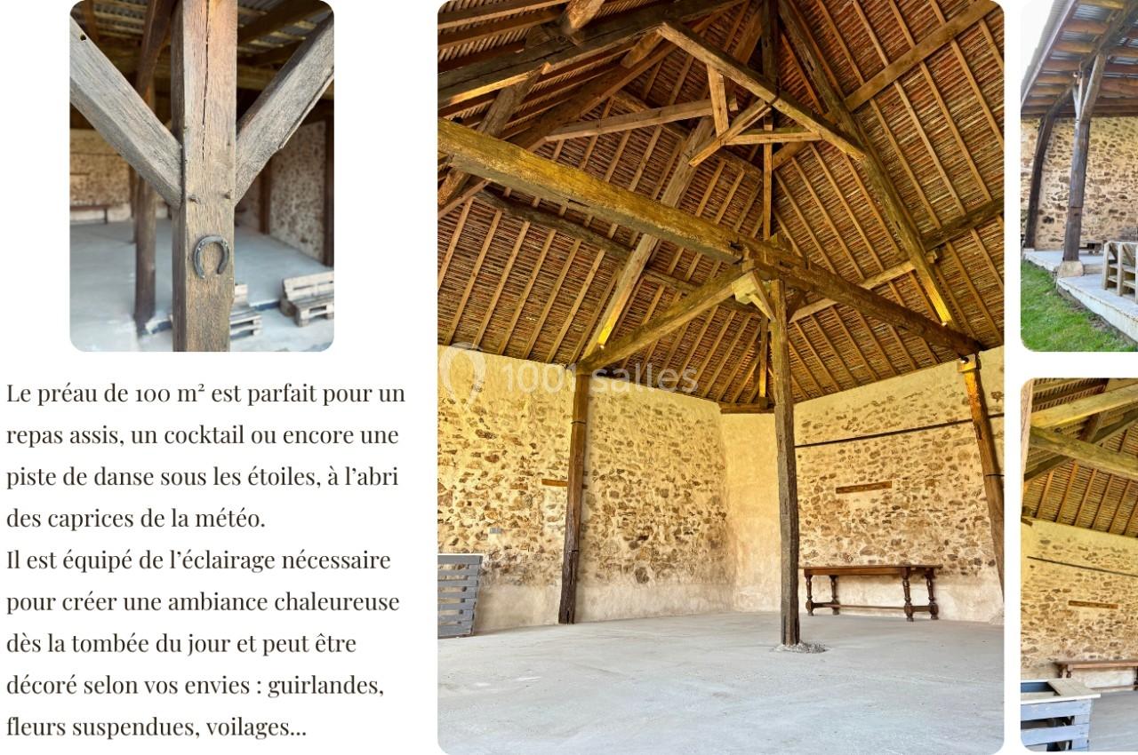 Charpente en bois apparente d'un préau spacieux en pierre, éclairé naturellement, avec un sol en béton lisse.