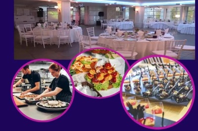 Buffet avec plusieurs plats chauds et froids présentés dans des récipients en inox sur une table noire.