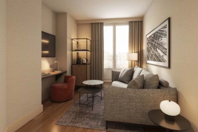 Salle de bain moderne avec lavabo suspendu, douche vitrée, toilettes et murs ornés de motifs en relief.