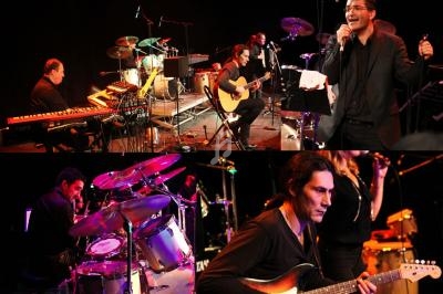 Musiciens jouant sur scène avec claviers, guitare, batterie et percussions, dans une ambiance de concert en direct.