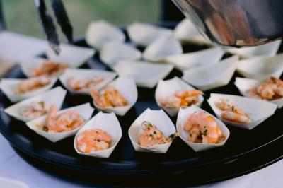 Miniature Location salle Valouse (Drôme) - Hameau de Valouse #30 Salle lumineuse avec tables et chaises en bois, grandes baies vitrées et plafond décoré de motifs végétaux.