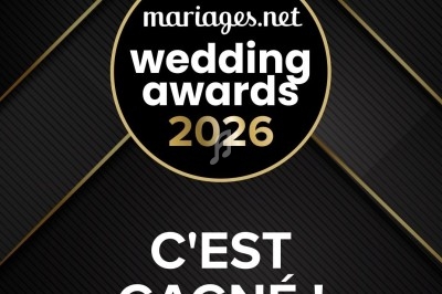 Logo des Wedding Awards 2026 de Mariages.net avec le texte ’C'est gagné !’ sur un fond noir et doré.