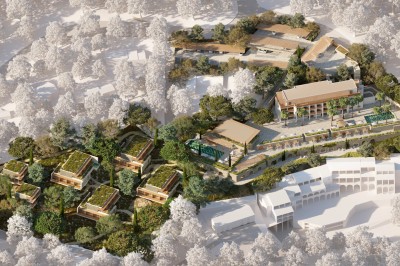 Vue aérienne d'un complexe architectural entouré de végétation, comprenant bâtiments modernes et espaces verts.