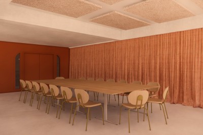 Vue aérienne d'un complexe architectural entouré de végétation, comprenant bâtiments modernes et espaces verts.