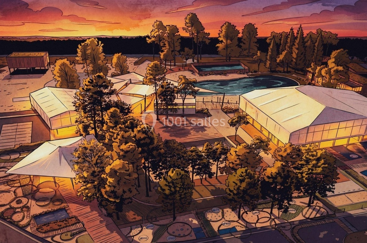 Vue aérienne d'un complexe avec bâtiments éclairés, piscine et espaces verts au coucher du soleil.