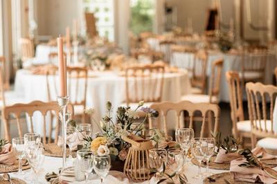 Miniature Location salle Guillon-les-Bains (Doubs) - Domaine Les Bains #3 Cuisine professionnelle équipée de plans de travail en inox, fours, étagères métalliques et carrelage mural blanc.