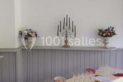 Miniature Location salle Guillon-les-Bains (Doubs) - Domaine Les Bains #17 Cuisine professionnelle équipée de plans de travail en inox, fours, étagères métalliques et carrelage mural blanc.